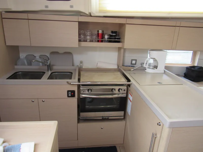 Slide: The Image of Modern kitchen in 2020 Beneteau Oceanis 46.1 yacht with stove, sink, and coffee maker. - 8