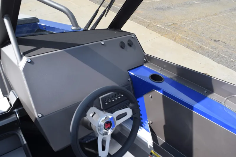 Slide: The Image of Interior view of 2026 Stabicraft 2050 Treker Profish boat dashboard and steering wheel. - 13
