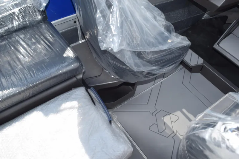 Slide: The Image of Interior of 2026 Stabicraft 2050 Treker Profish with plastic-covered seats and modern flooring. - 16