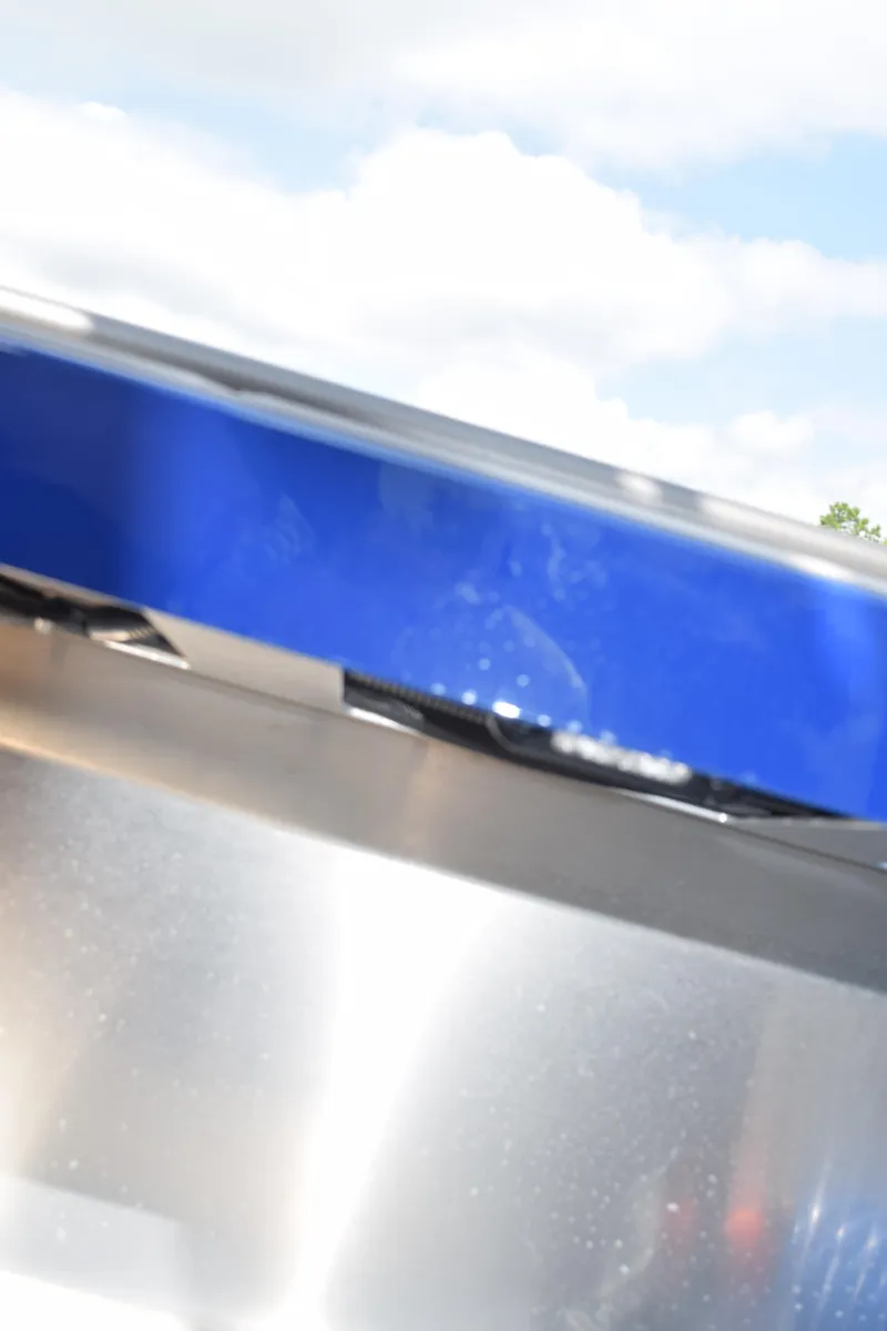 Slide: The Image of 2026 Stabicraft 2050 Treker Profish boat, close-up view with blue and silver details. - 21