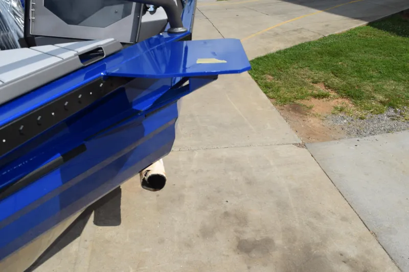 Slide: The Image of 2026 Stabicraft 2050 Treker Profish boat detail, blue exterior, docked on concrete surface. - 6