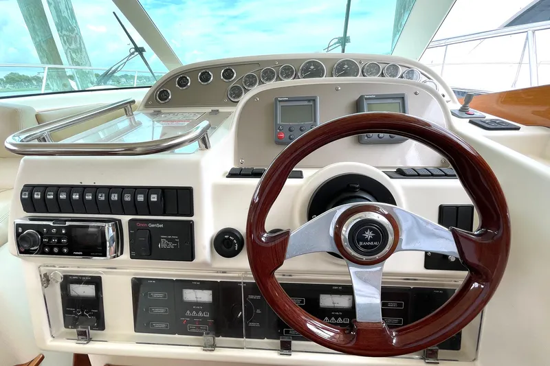 Slide: The Image of Cockpit of 2007 Jeanneau Prestige 46 yacht with steering wheel and control panel. - 14