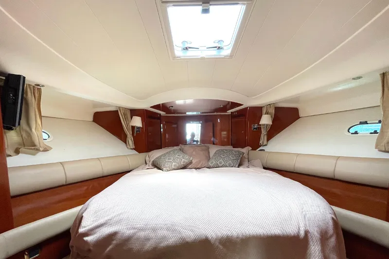 Slide: The Image of Luxurious cabin interior of 2007 Jeanneau Prestige 46 yacht with cozy bedding. - 15