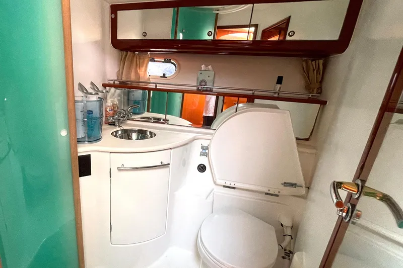 Slide: The Image of Bathroom interior of 2007 Jeanneau Prestige 46 yacht, featuring sink, toilet, and mirror. - 17