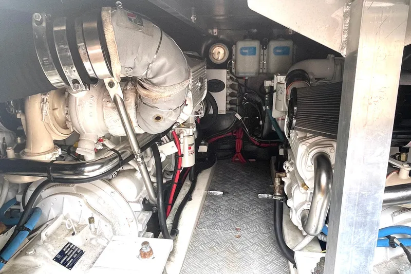 Slide: The Image of Engine room of a 2007 Jeanneau Prestige 46 yacht, showcasing mechanical components. - 22