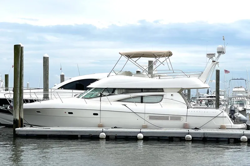 Slide: The Image of 2007 Jeanneau Prestige 46 yacht docked at marina, side view. - 3