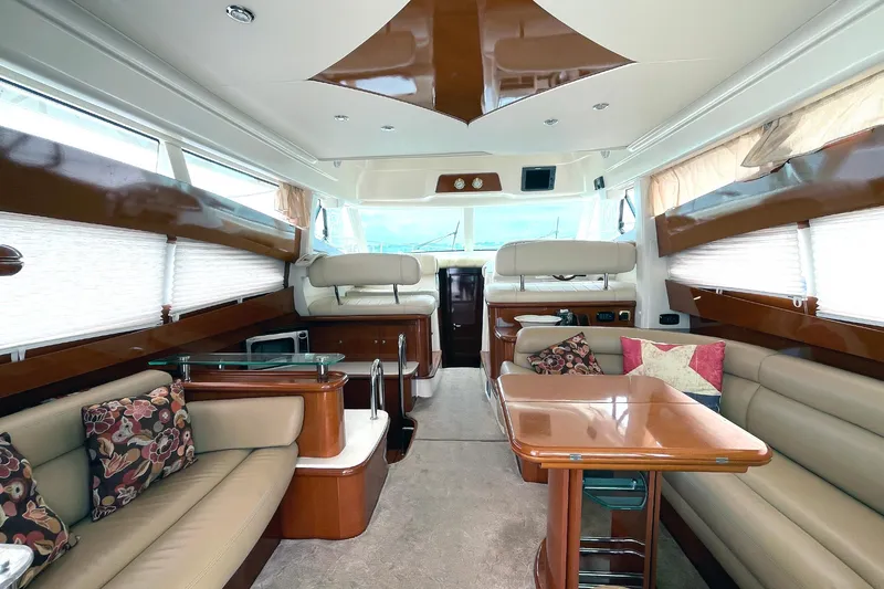 Slide: The Image of Luxurious interior of 2007 Jeanneau Prestige 46 yacht with elegant seating and wooden finishes. - 5