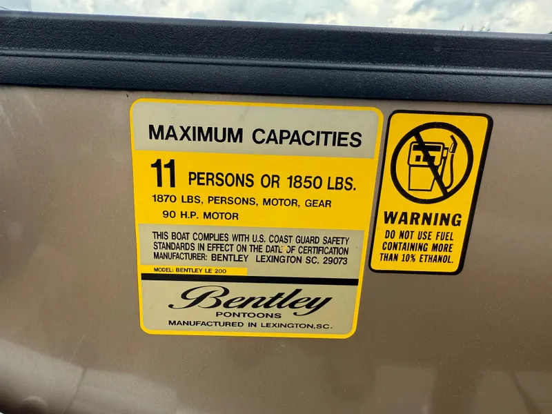 Slide: The Image of 2023 Bentley Pontoons LE 200 capacity label, 11 persons or 1850 lbs, ethanol warning. - 11