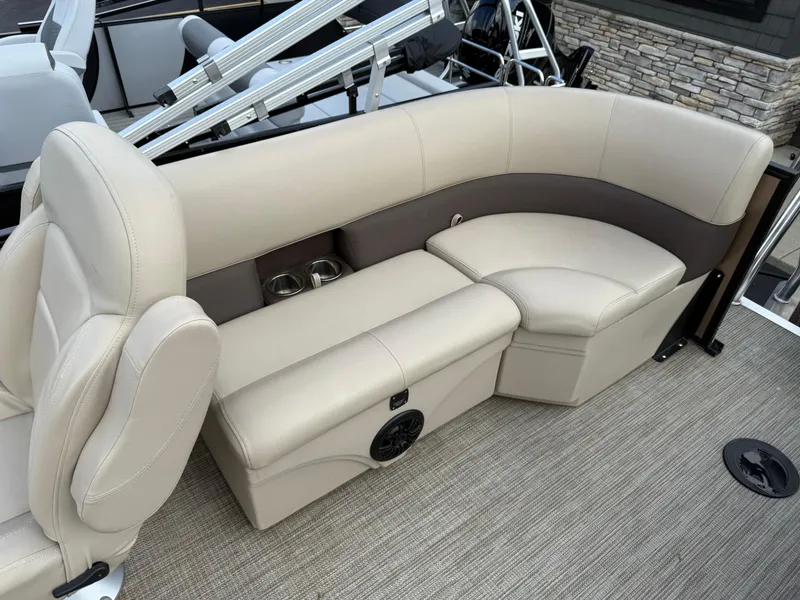 Slide: The Image of 2023 Bentley Pontoons LE 200 interior with beige leather seating and cup holders. - 15