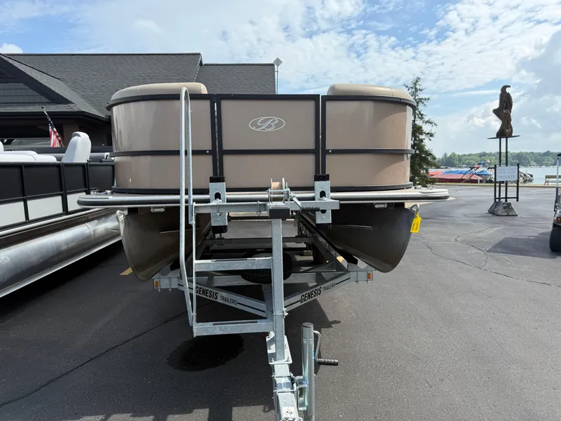 Slide: The Image of 2023 Bentley Pontoons LE 200 on trailer, parked outdoors under a partly cloudy sky. - 3