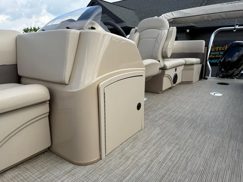 Slide: The Image of 2023 Bentley Pontoons LE 200 interior with beige seating and console. - 8