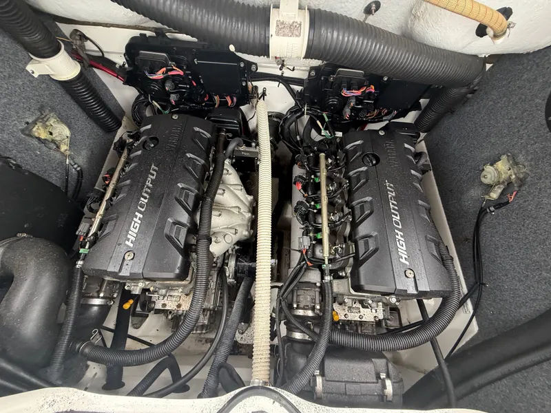 Slide: The Image of 2011 Yamaha Boats SX240 HO engine compartment with dual high-output engines. - 10