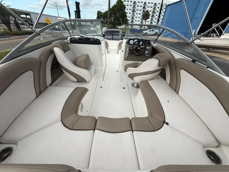 Slide: The Image of 2011 Yamaha Boats SX240 HO interior with spacious seating and modern dashboard. - 4