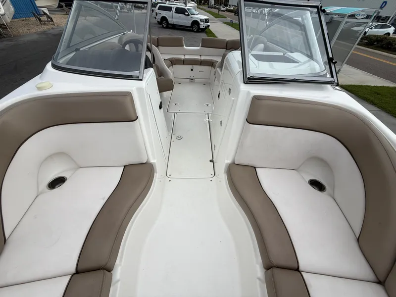 Slide: The Image of 2011 Yamaha Boats SX240 HO interior with beige and white seating, open bow design. - 9