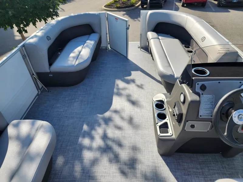 Slide: The Image of 2026 Sun Tracker Party Barge 16 interior with spacious seating and modern helm. - 5