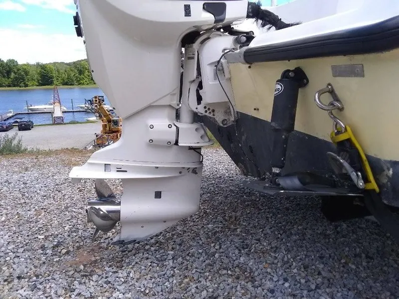 Slide: The Image of 2001 Mako 192 Center Console boat engine, parked on gravel near a lake. - 12