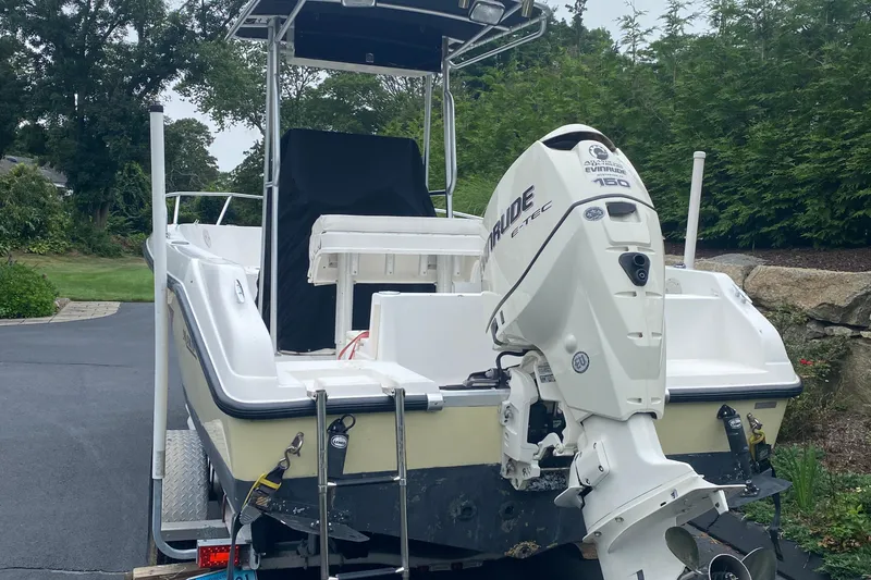 Slide: The Image of 2001 Mako 192 Center Console boat with Evinrude engine on a trailer. - 4