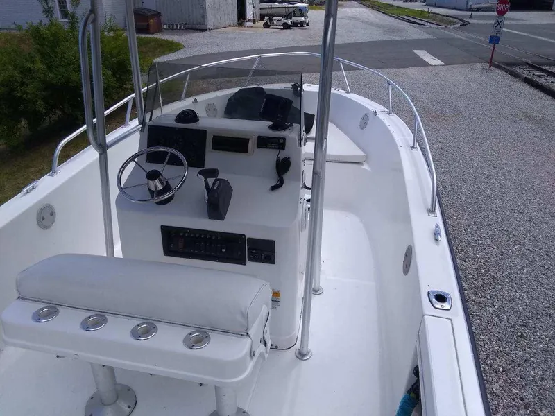 Slide: The Image of 2001 Mako 192 Center Console boat with steering wheel and control panel. - 9