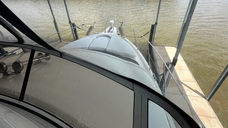 Slide: The Image of 2008 Silverton 35 Motor Yacht docked, viewed from above, with water and pier visible. - 20