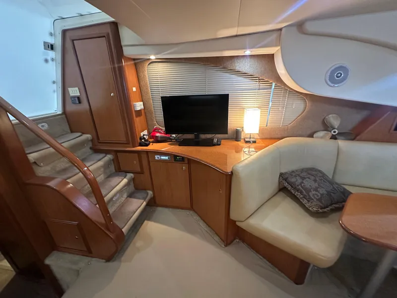 Slide: The Image of Interior of 2008 Silverton 35 Motor Yacht with cozy seating and entertainment area. - 22