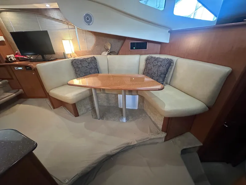 Slide: The Image of 2008 Silverton 35 Motor Yacht interior with cozy dining area and modern amenities. - 29