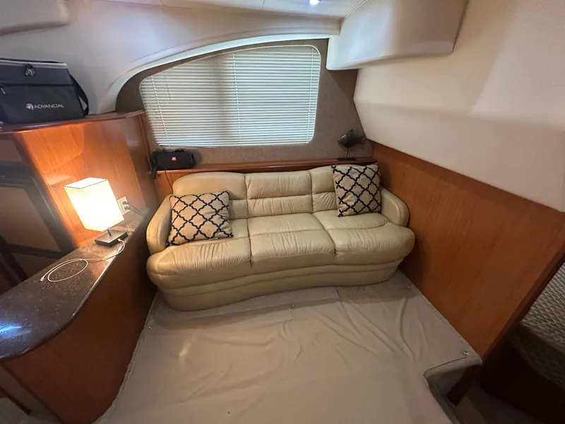 Slide: The Image of Interior of 2008 Silverton 35 Motor Yacht with beige sofa and decorative pillows. - 31