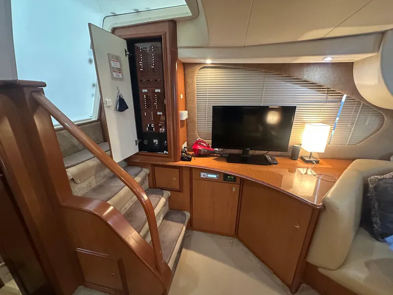 Slide: The Image of Interior of 2008 Silverton 35 Motor Yacht with stairs, control panel, TV, and lamp. - 33