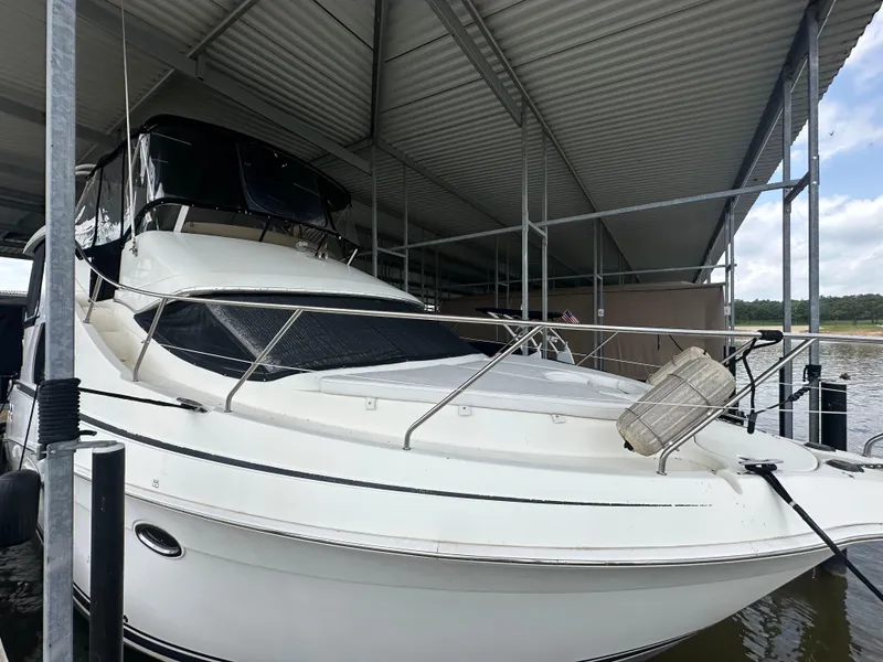 Slide: The Image of 2008 Silverton 35 Motor Yacht docked under a covered marina. - 4