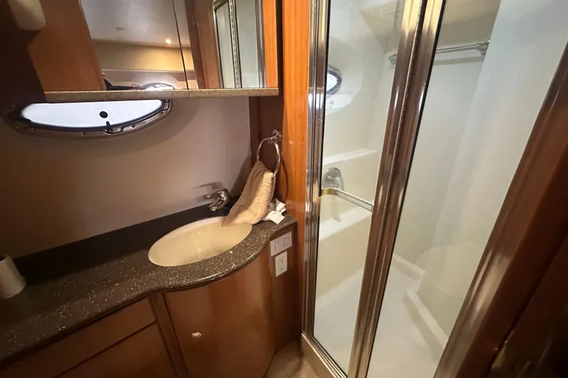 Slide: The Image of 2008 Silverton 35 Motor Yacht bathroom with sink, mirror, and shower. - 47