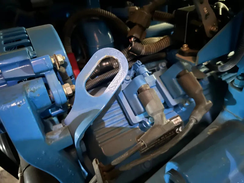 Slide: The Image of Close-up of a 2008 Silverton 35 Motor Yacht engine component, featuring blue mechanical parts. - 51