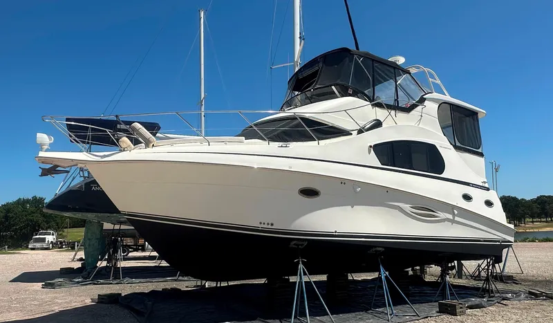 Slide: The Image of 2008 Silverton 35 Motor Yacht on stands, clear sky background. - 6