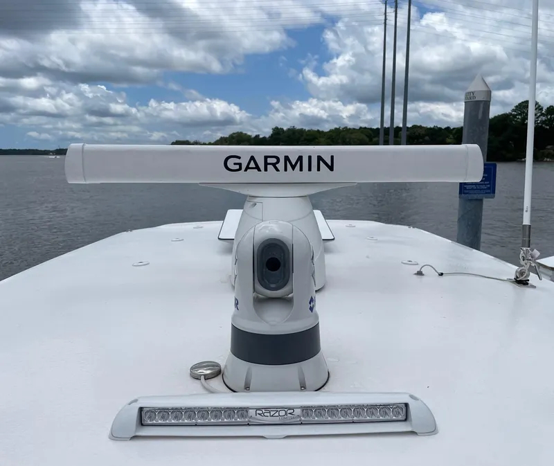 Slide: The Image of Garmin radar on 2024 Sea Hunt Ultra 305 SE boat, under cloudy sky. - 25