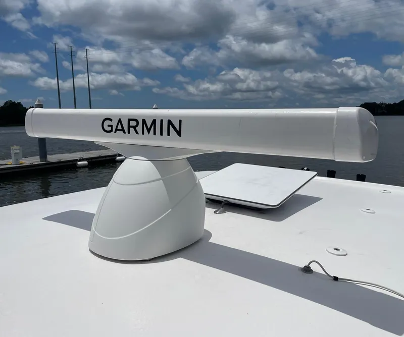 Slide: The Image of Garmin radar on 2024 Sea Hunt Ultra 305 SE boat under cloudy sky. - 26