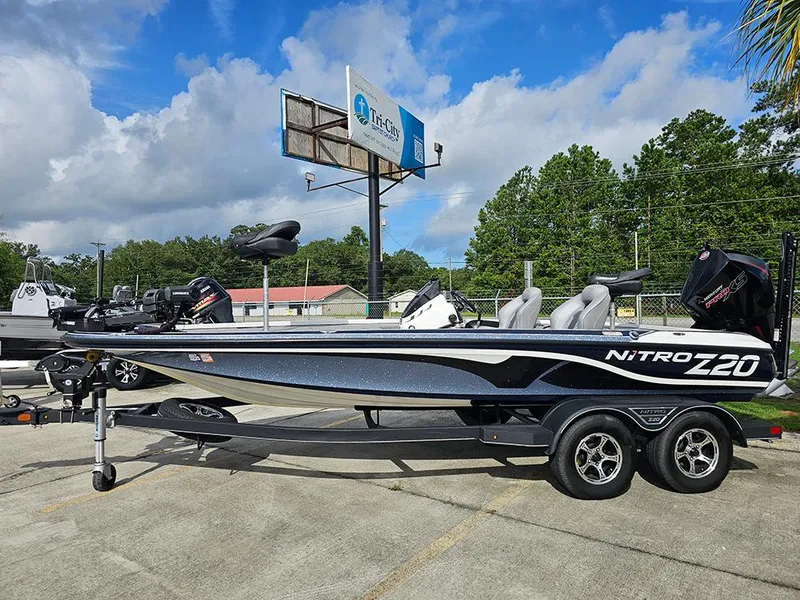 Slide: The Image of 2023 Nitro Z20 Pro boat on trailer, parked outdoors under a cloudy sky. - 1