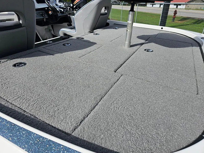 Slide: The Image of 2023 Nitro Z20 Pro boat interior with gray carpeted deck and seating. - 10