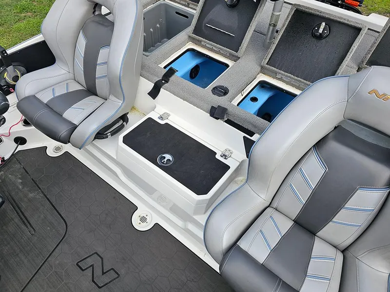 Slide: The Image of 2023 Nitro Z20 Pro boat interior with gray seats and storage compartments. - 12