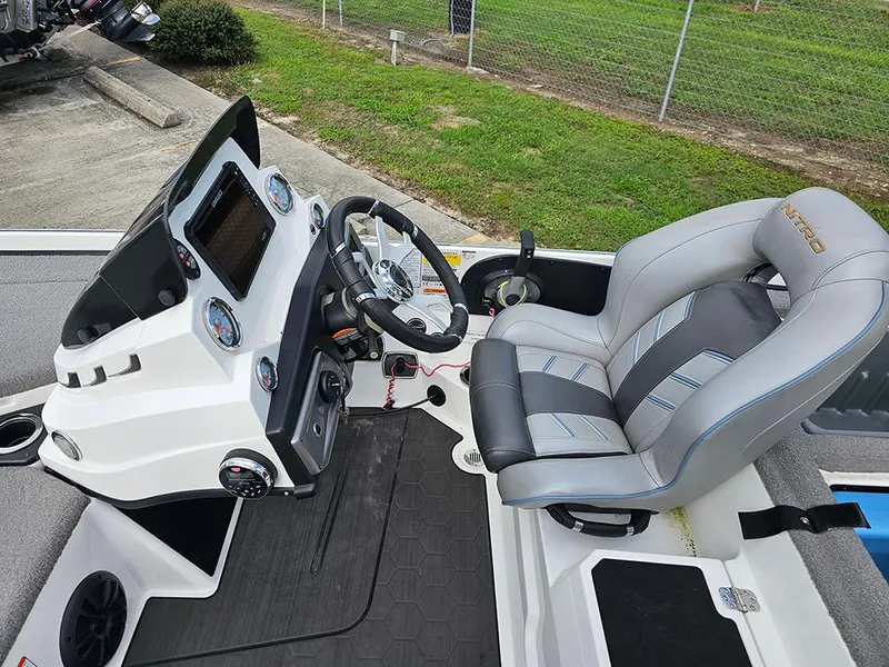 Slide: The Image of Nitro Z20 Pro 2023 boat cockpit with steering wheel and control panel. - 14