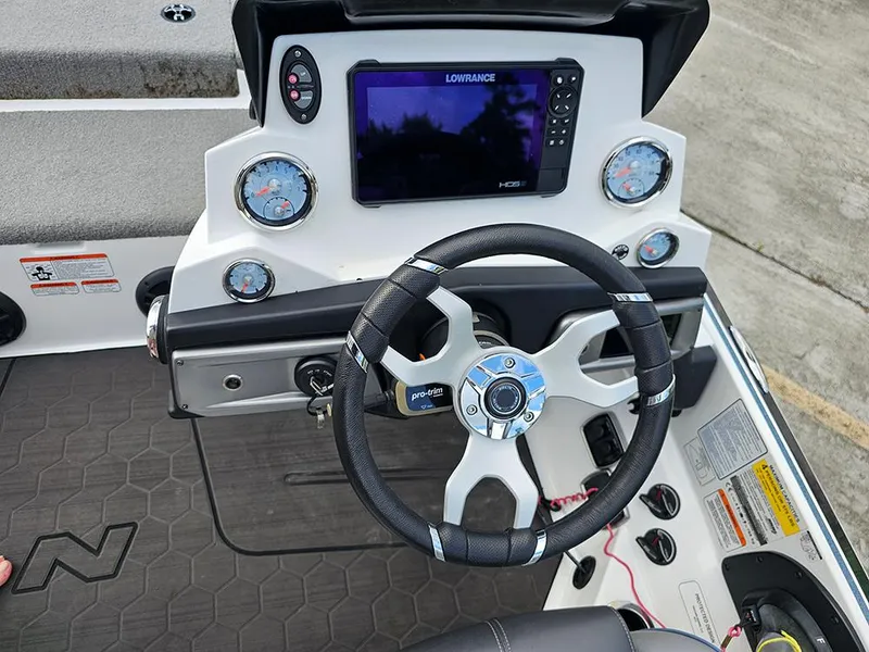 Slide: The Image of Steering console of 2023 Nitro Z20 Pro boat with gauges and Lowrance display. - 15