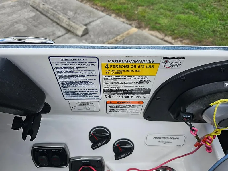 Slide: The Image of Control panel of a 2023 Nitro Z20 Pro boat, showing capacity and safety instructions. - 16