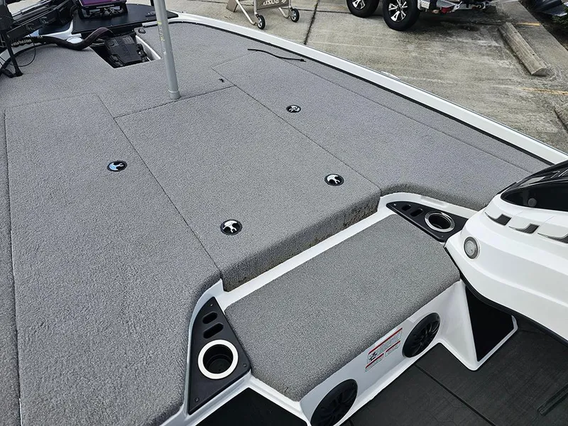 Slide: The Image of 2023 Nitro Z20 Pro boat deck with gray carpet and storage compartments. - 17
