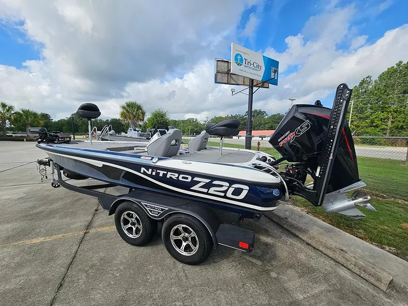 Slide: The Image of 2023 Nitro Z20 Pro boat on trailer, parked outdoors under cloudy sky. - 3