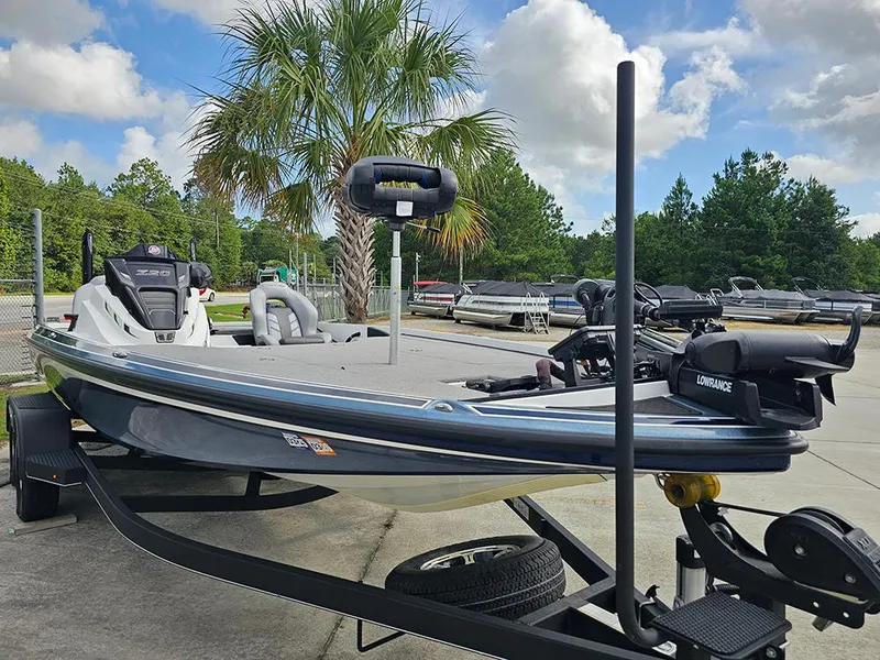 Slide: The Image of 2023 Nitro Z20 Pro boat on trailer, parked outdoors under a clear sky. - 5