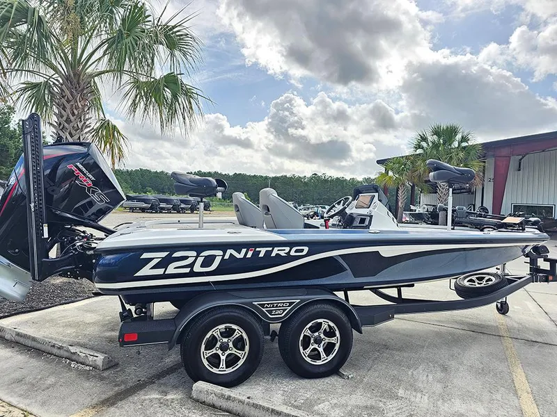 Slide: The Image of 2023 Nitro Z20 Pro boat on trailer, parked outdoors under cloudy sky. - 7