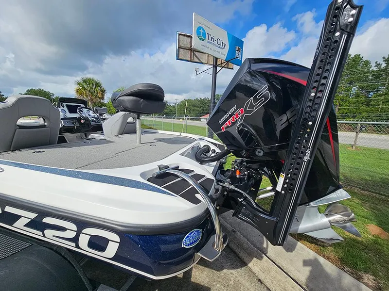 Slide: The Image of 2023 Nitro Z20 Pro boat with Mercury Pro XS engine, parked outdoors under cloudy sky. - 9