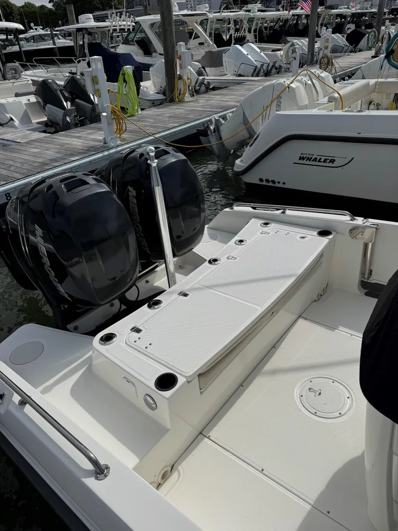 Slide: The Image of 2017 Boston Whaler 270 Dauntless boat docked, featuring dual outboard engines. - 3