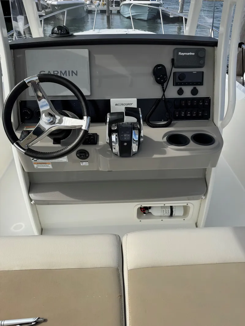 Slide: The Image of 2017 Boston Whaler 270 Dauntless helm with Garmin and Raymarine electronics. - 7
