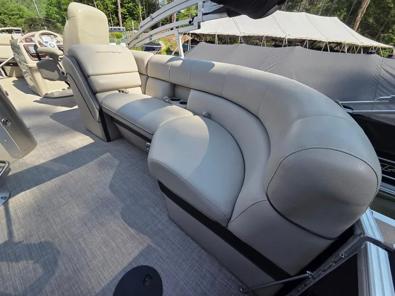 Slide: The Image of Luxurious seating on 2018 South Bay 523 pontoon boat, featuring plush gray upholstery. - 13