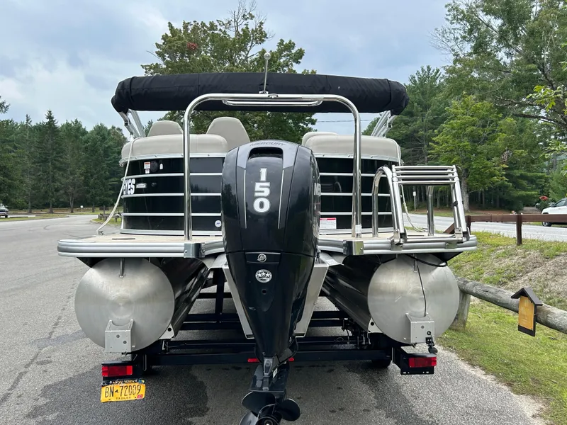 Slide: The Image of 2018 South Bay 523 pontoon boat with Mercury 150 engine, parked on a trailer. - 3