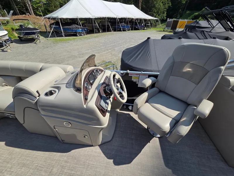Slide: The Image of 2018 South Bay 523 boat interior with steering console and captain's chair. - 7