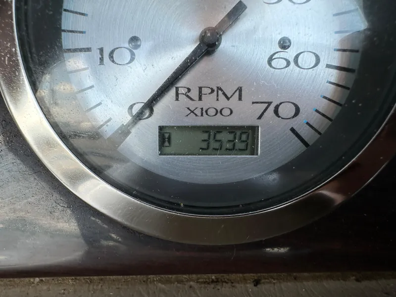 Slide: The Image of Close-up of a 2012 Bennington 2275 GS RPM gauge displaying 353.9 hours. - 21